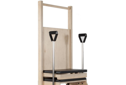 Pilates chair with maple laminate back and upholstered seat for enhanced support.